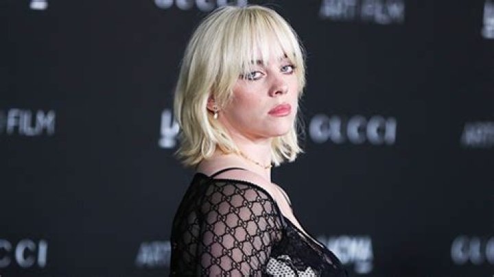 Billie Eilish Slays In Tooth Gems & White Lace Tights: Photos – Hollywood Life